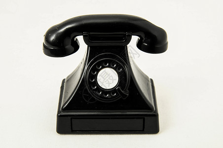 磨练旧旧电话红色玩具拨号听筒讲话黑色蓝色电讯怀旧喇叭背景