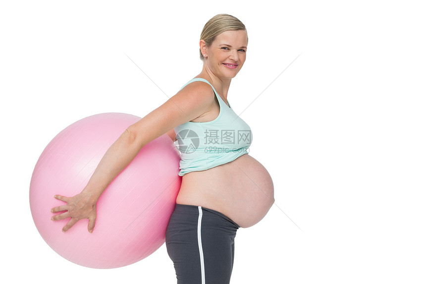 孕妇背后拿着粉红色运动球 背着她图片
