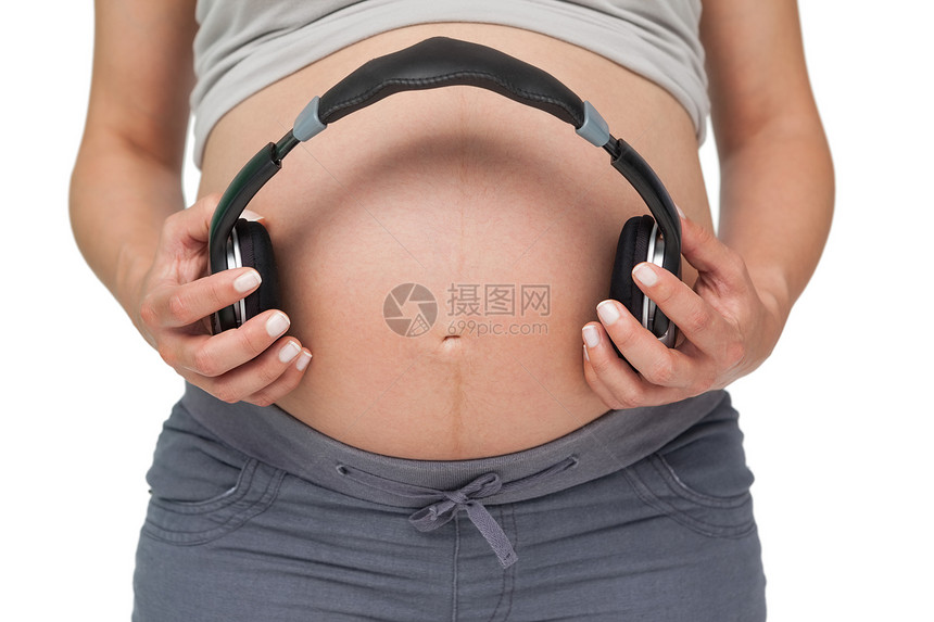持耳机的孕妇超音速图片