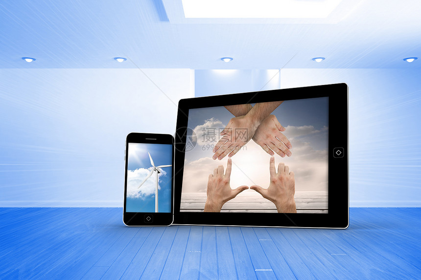 智能手机和平板屏幕上的手和风涡轮机复合图像双手绘图风车蓝色窗户白色媒体电脑设备房间图片