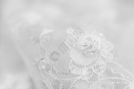蕾丝装饰花边美丽的蕾带花边材料织物宏观风格装饰装饰品新娘玫瑰婚礼背景