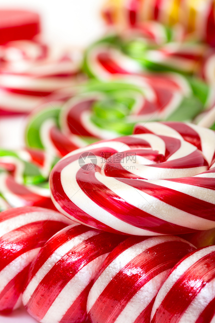 多色棒棒棒糖食物漩涡绿色黄色红色条纹白色糖果圆形团体图片
