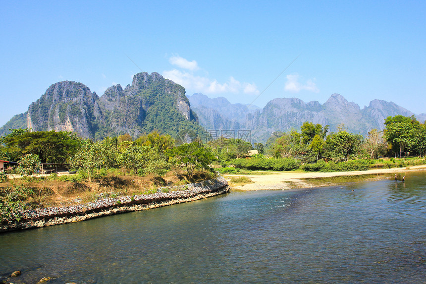 由老挝范维昂的宋河环绕旅行文化森林旅游村庄乡村场景假期绿色热带图片