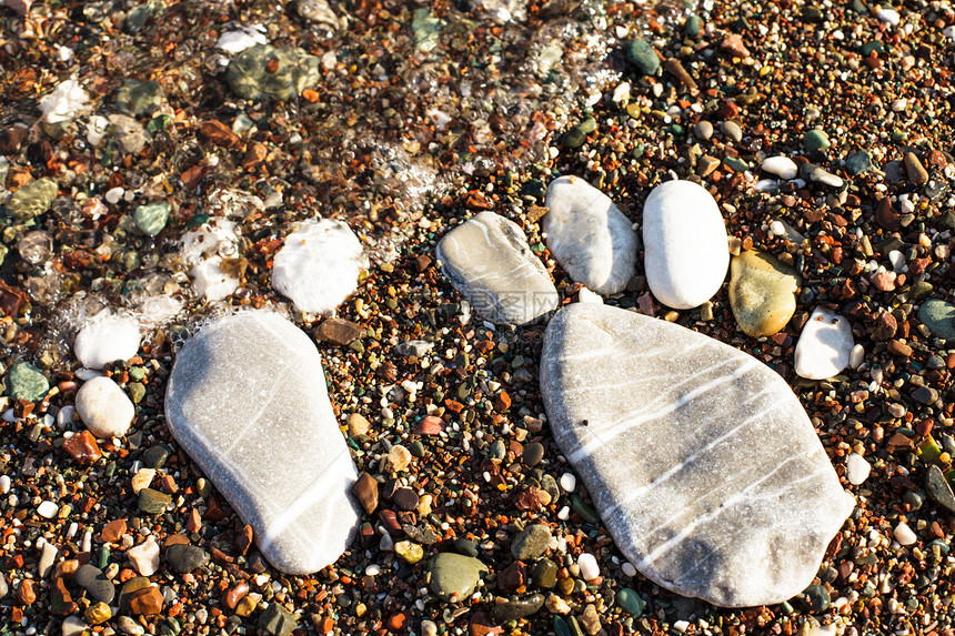 石脚足球爪子卵石印刷假期海滩乐趣脚跟石头脚印图片