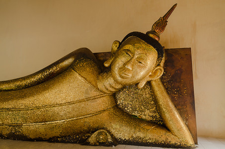 Gild buddha雕像睡在一边背景图片