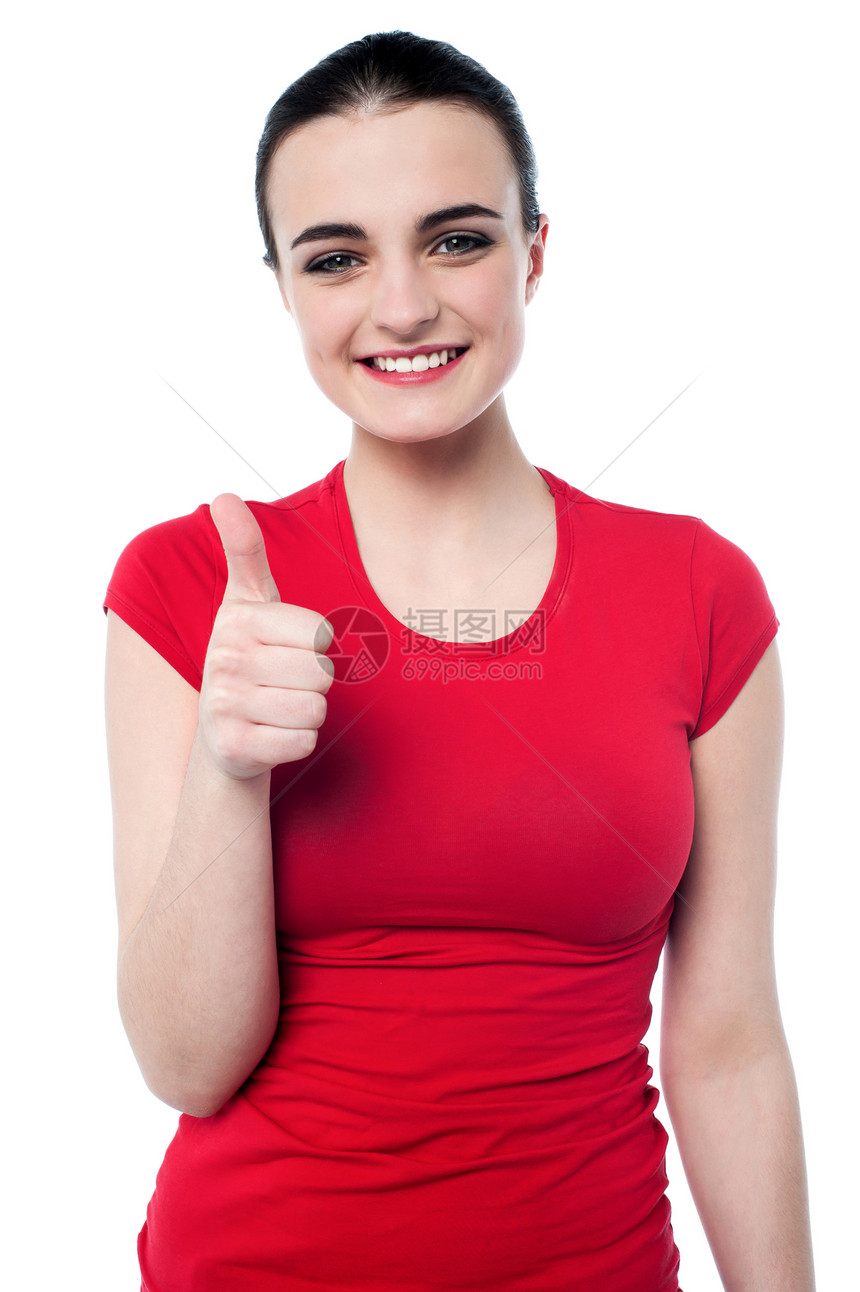 迷人的姑娘举起大拇指工作室美丽青少年女孩微笑女性青年冒充白色快乐图片