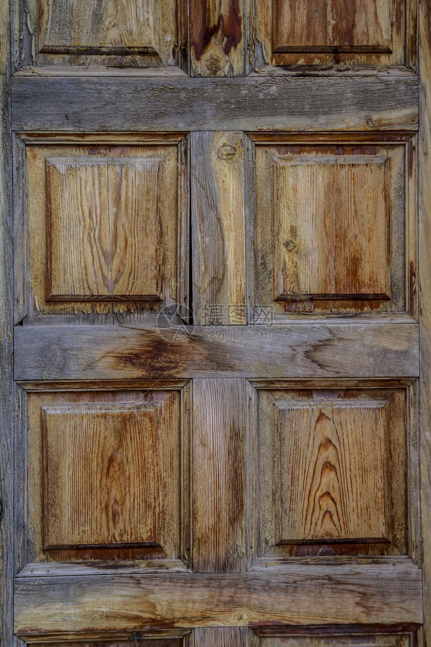 果实木木门 西班牙风格历史性入口栅栏古董木头风化控制板金属安全石头图片