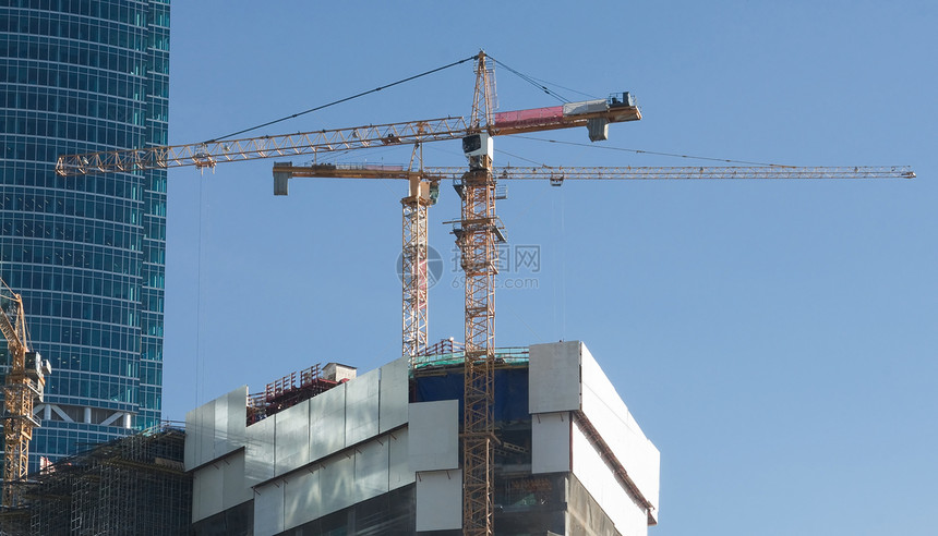 提升起重机建筑学商业机器建筑活动天空蓝色建造场景城市图片