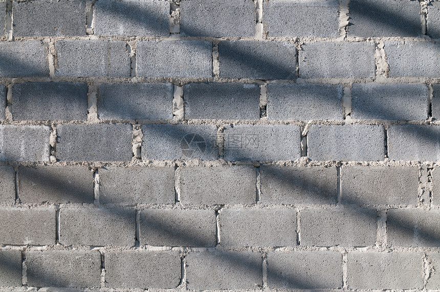 砖砖墙阳光划痕绘画水泥正方形网格石膏插图积木阴影图片