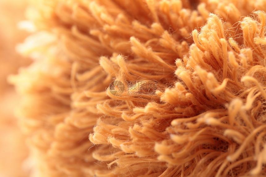 人工毛皮纹理温暖黄色材料文摘农场羊毛纺织品羊皮棕褐色柔软度图片