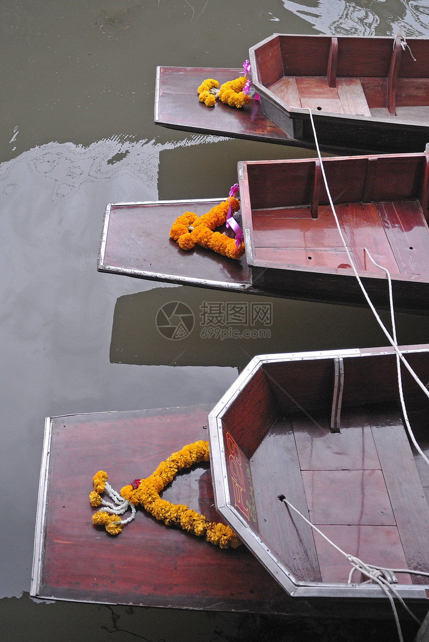 漂浮市场中的木船绳索夹板领带工艺游艇旅行合金支撑带子港口图片