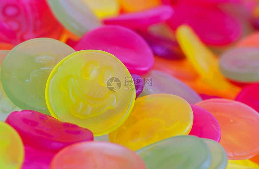 色彩多彩的糖果面孔小吃水果着色剂巧克力橙子食物笑脸气泡茶点彩虹图片