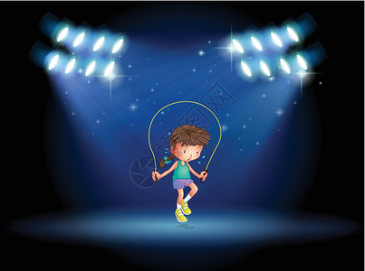 一个女孩在聚光灯下玩跳绳高清图片