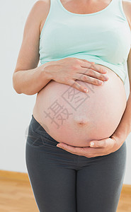 怀着大额婴儿潮的孕妇背景图片