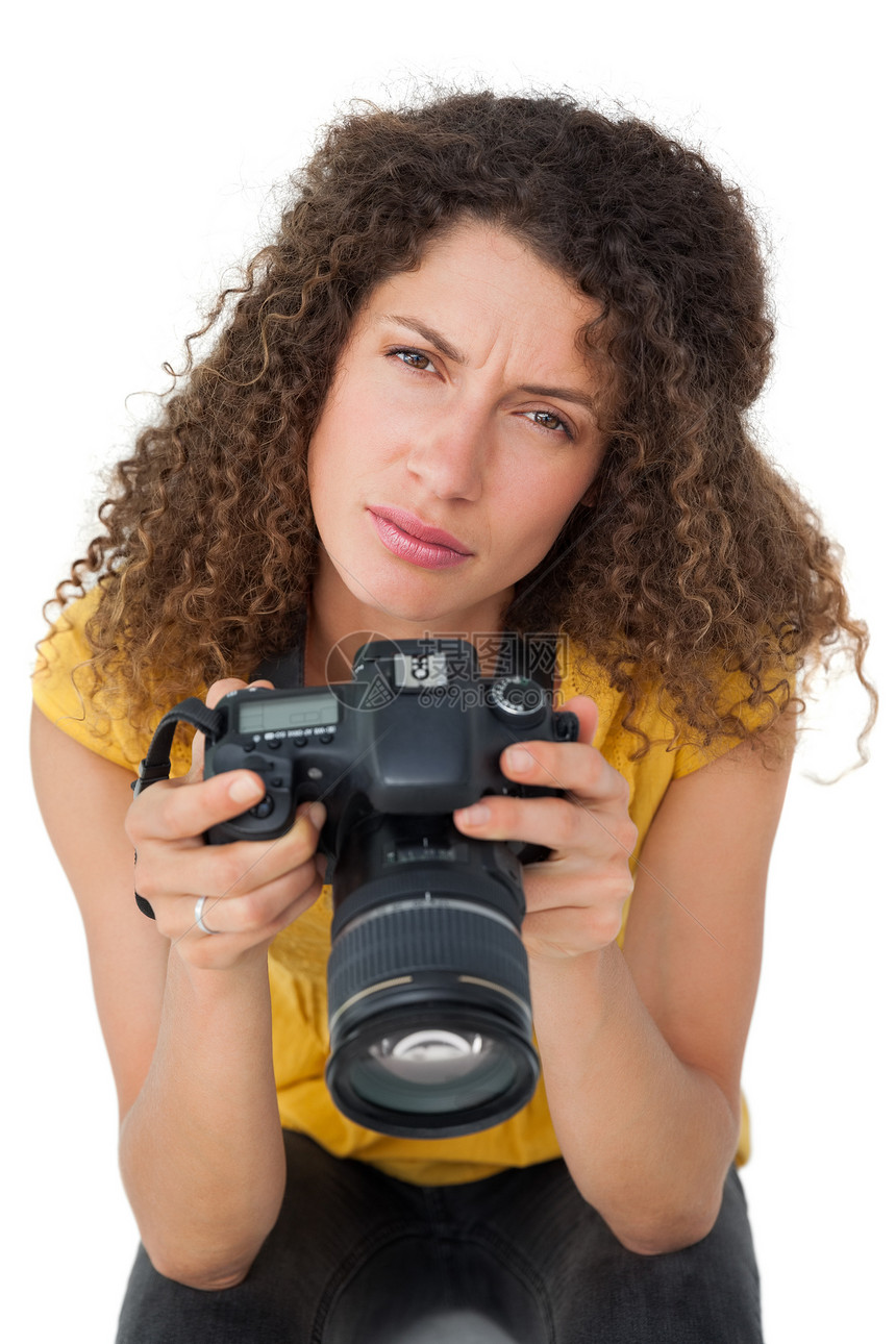 一名女摄影师的肖像爱好单反技术棕色闲暇女性女士卷发相机摄影图片