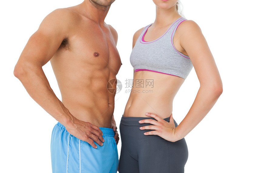 健康年轻夫妇的中间部分调子文胸肌肉男人力量训练运动服身体夫妻运动图片