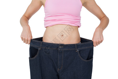 滋养胃阴穿着旧牛仔裤的美丽女性身体中间部分背景