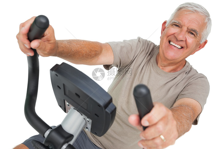 一个骑固定自行车的快乐老年男子的肖像运动服男性纺纱身体男人运动健身成人微笑锻炼图片