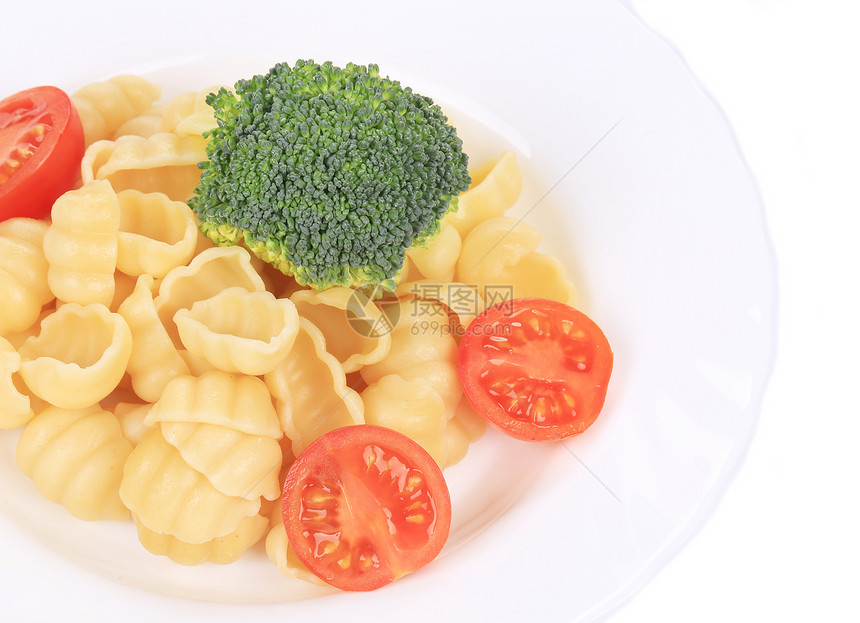 加花椰菜和番茄的意大利面蔬菜食物黄色盘子香菜绿色美食胡椒草药图片