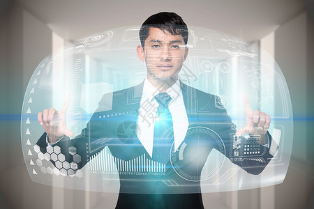 认真的商务人士触摸界面科技绘图人士计算机男性数字互动混血商业套装背景图片