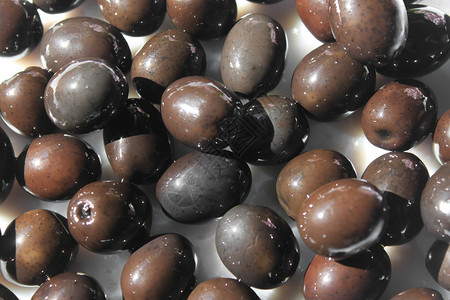 水俣橄榄食物水果盘子黑色美食背景图片