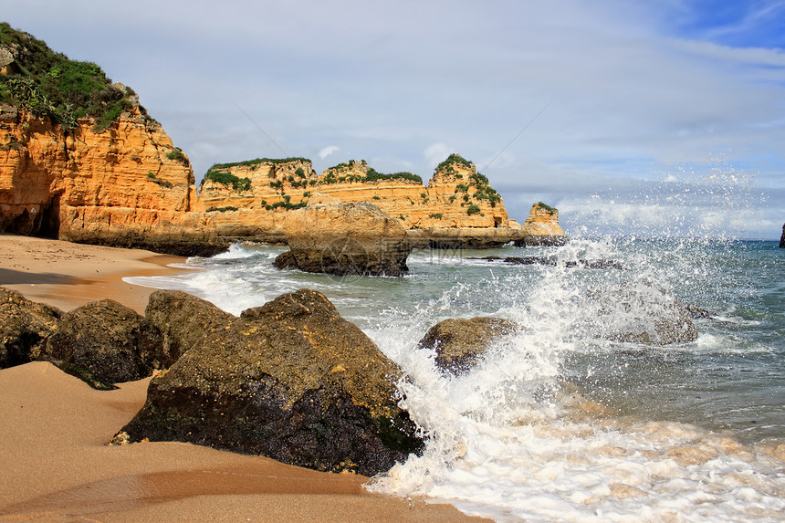 葡萄牙拉各斯岩石旅行海滩旅游晴天赭石蓝色海洋海岸悬崖图片