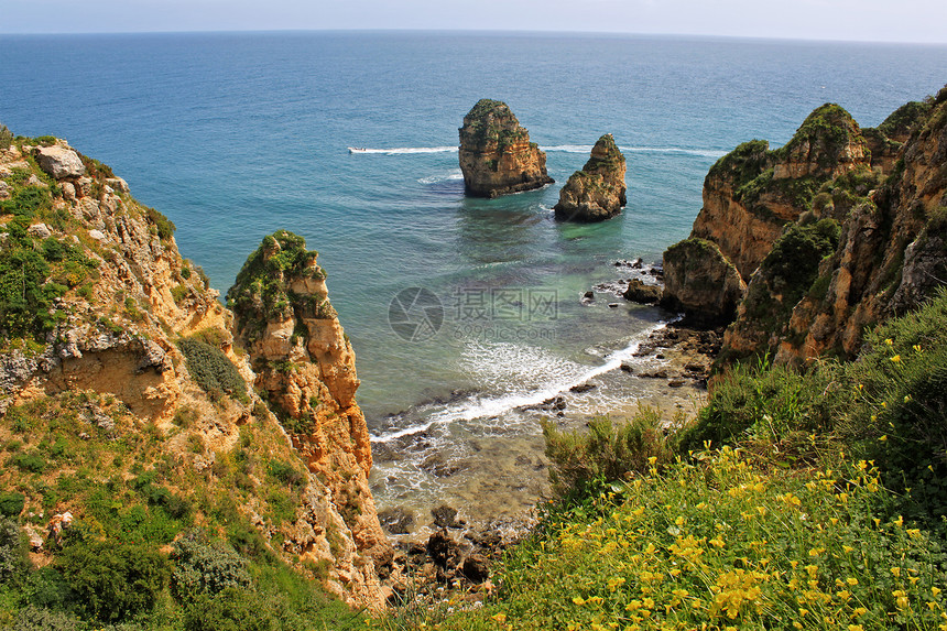 悬崖旅行石窟支撑海岸海洋蓝色天空侵蚀风景岩石图片