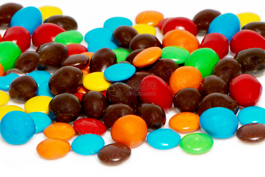 许多彩色的糖果填充背景图片