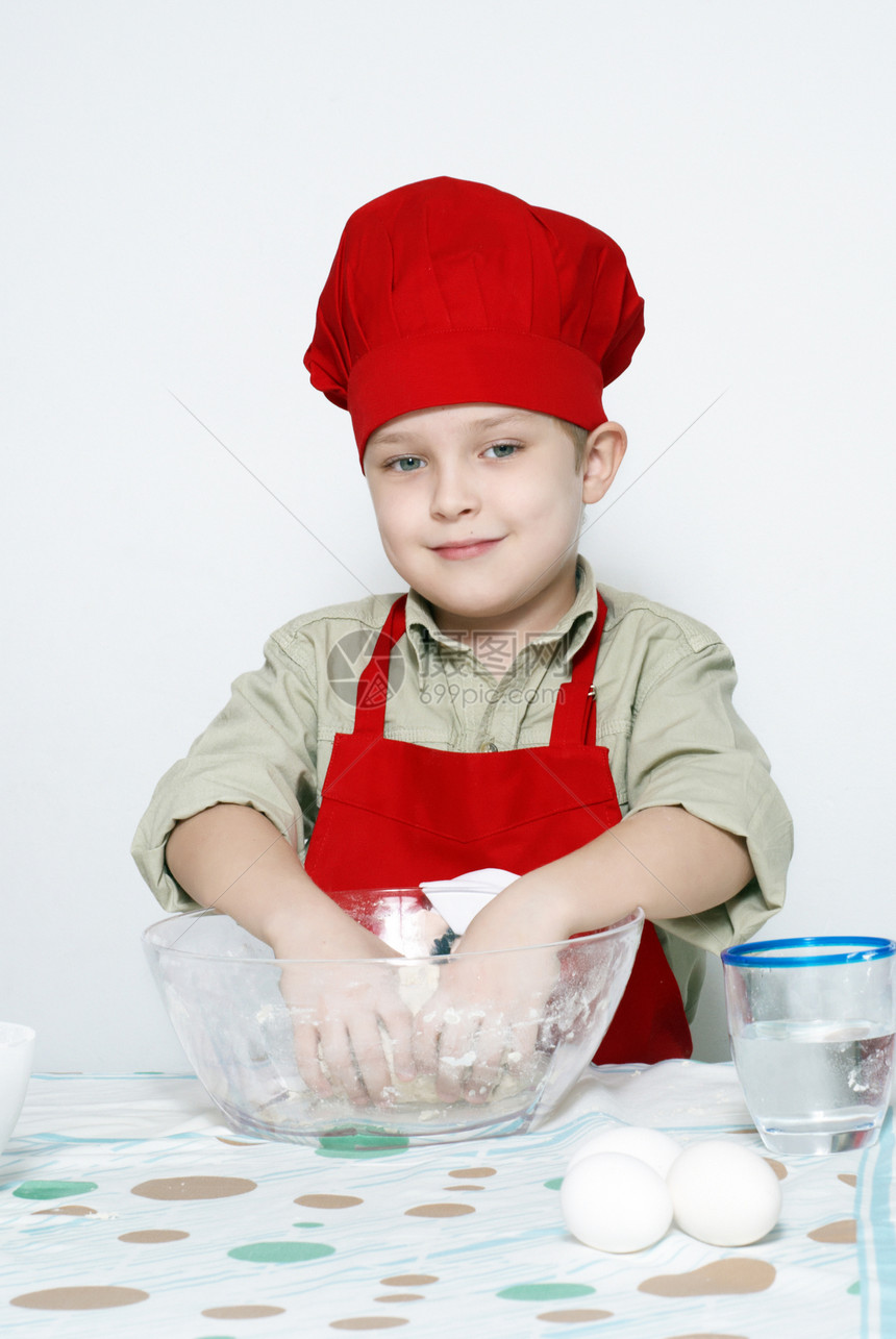 快乐的有吸引力的小厨师肖像红色美食玻璃厨房食谱帮助商品帽子职业儿子图片