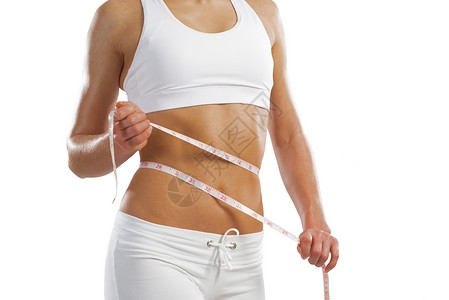 腰部的年轻运动女性橘皮身体饮食组织肥胖数字测量女士腰围磁带背景图片