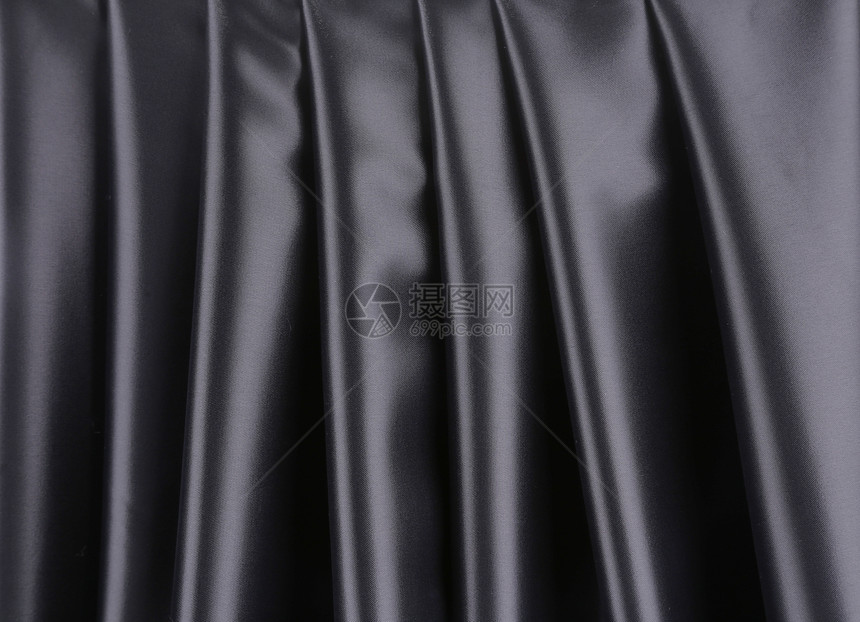 黑色丝绸背景材料褶皱折痕投标纺织品布料热情窗帘奢华海浪图片