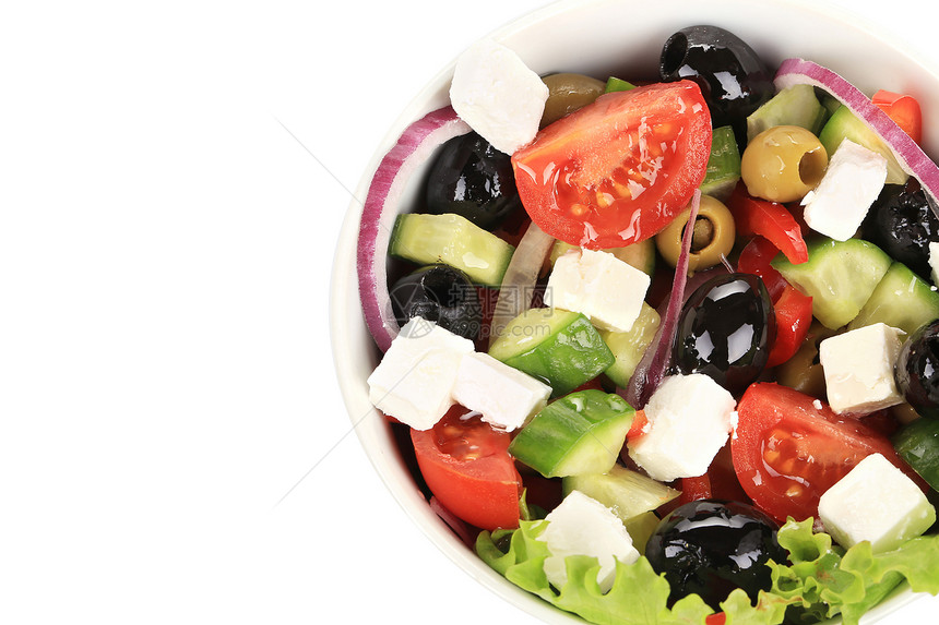 泥碗里新鲜的希腊沙拉午餐白色美食黑色叶子洋葱长叶莴苣红色食物图片