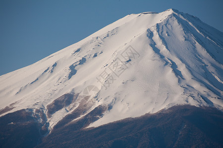 从日本来的Fuji山顶的缩放白色顶峰地标旅行天空蓝色背景图片