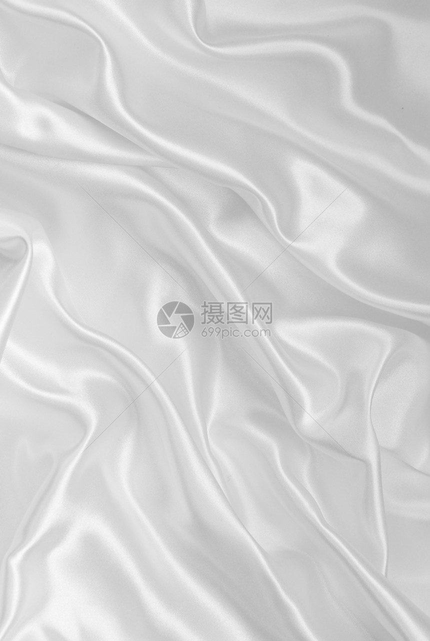 平滑优雅的白色丝绸作为背景银色材料海浪织物投标涟漪婚礼感性曲线新娘图片