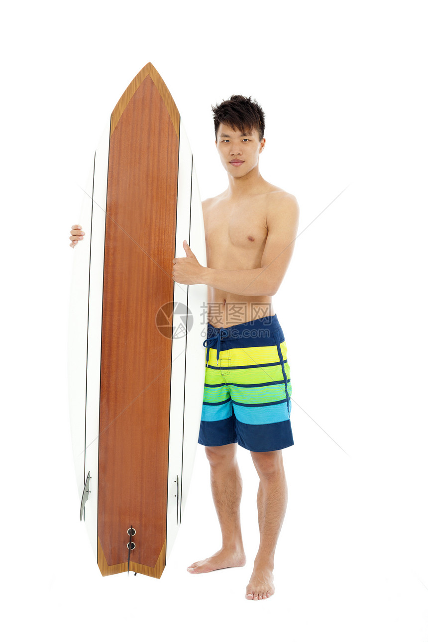 年轻人用冲浪板拇指图片