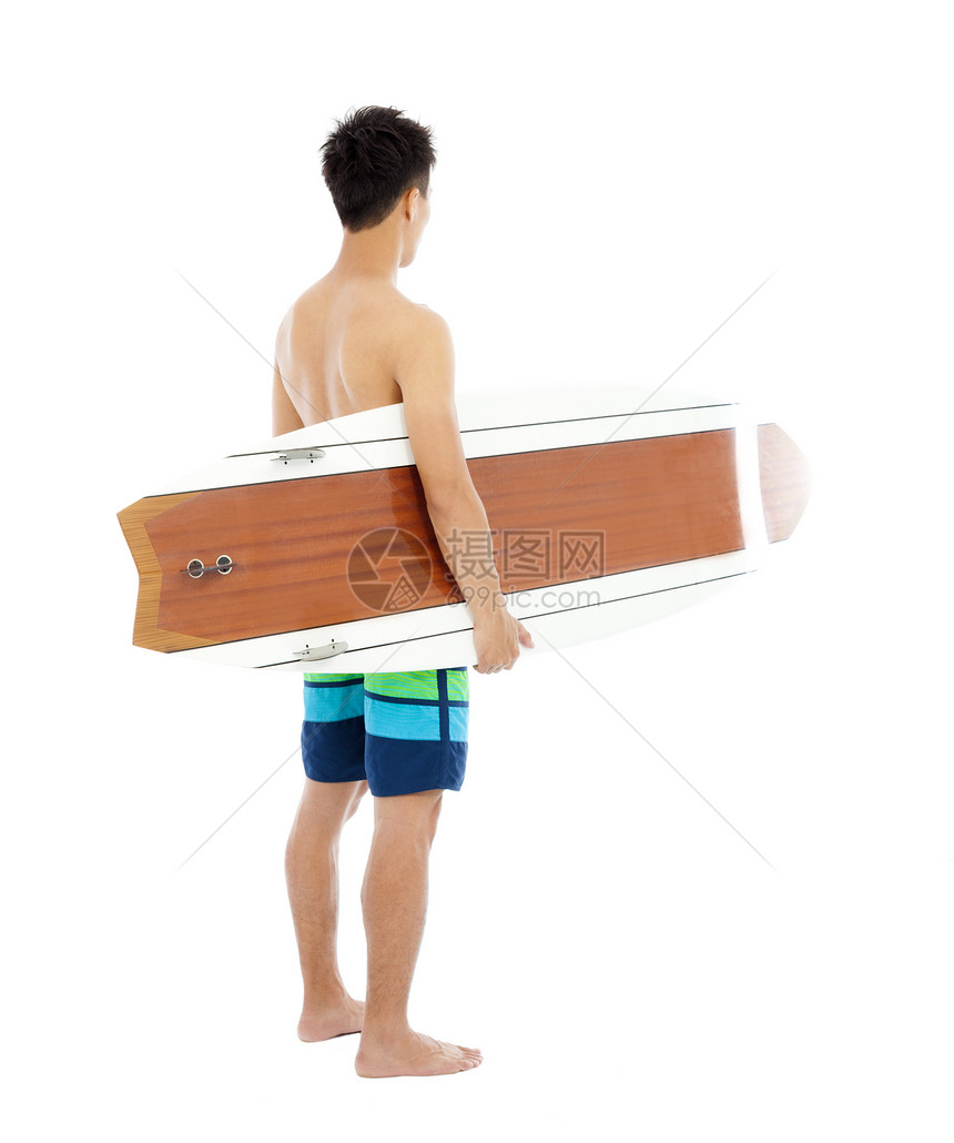 年轻男孩在白色背景上持冲浪板消遣乐趣海浪爱好娱乐男生晴天海洋快乐热情图片