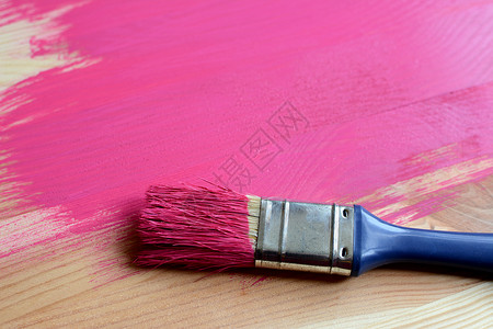 油漆木上涂漆的油漆画笔刷背景图片