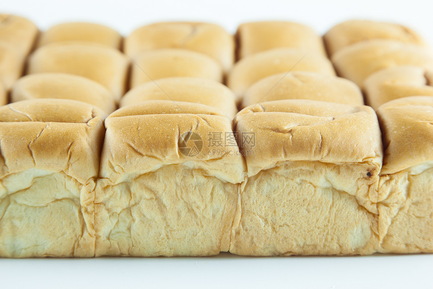 白色背景上的面包小吃面粉化合物碳水棕色厨房饮食工作室包子食物图片
