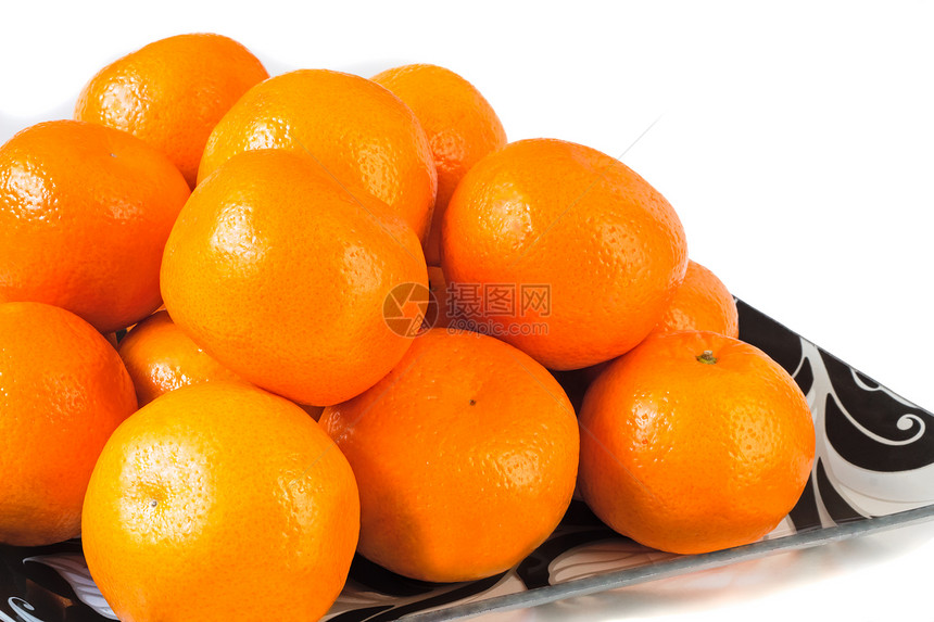在白色背景的玻璃碗里 盛大的成熟橘子维生素盘子产品甜点芳香果汁食物饮食深色水果图片