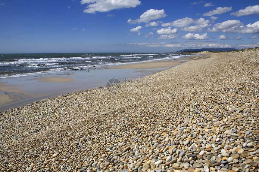 海滩沙滩鹅卵石孤独蓝色波浪波纹海岸海洋海景石头假期图片