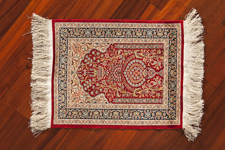 土地毯装饰品红色纺织品挂毯艺术小地毯丝绸羊毛材料古董背景图片