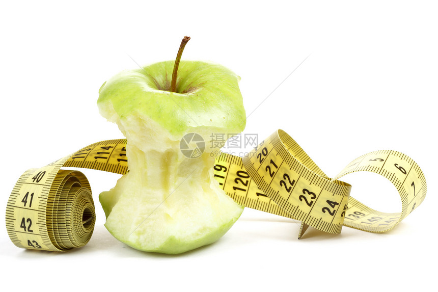 用测量磁带在白色上隔离的绿色比特点苹果宏观花园小吃废料食物厘米果汁水果美食阴影图片