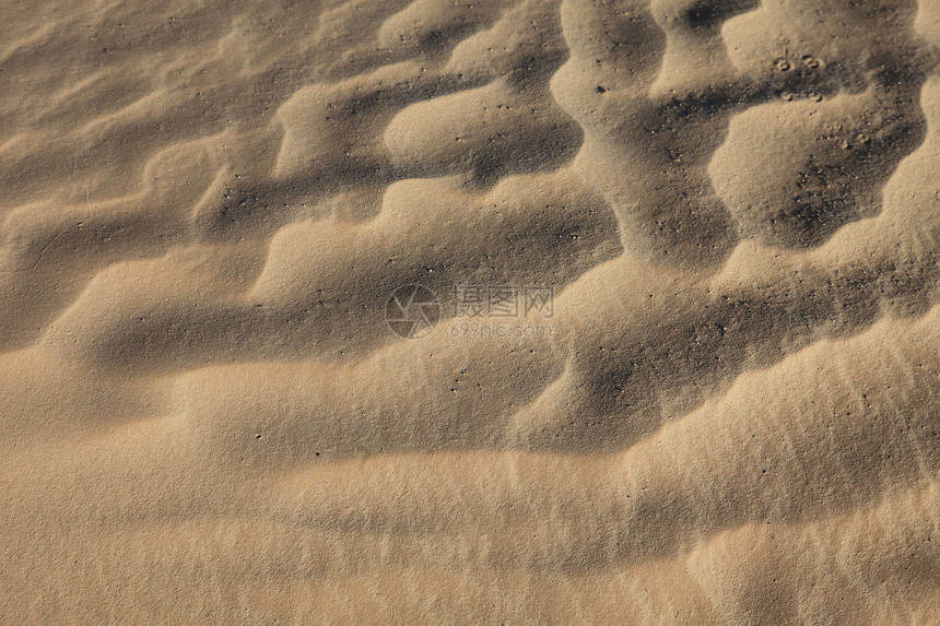 萨哈尔沙地上的风纹理地形金子孤独波纹橙子情调土地荒野异国旅行图片