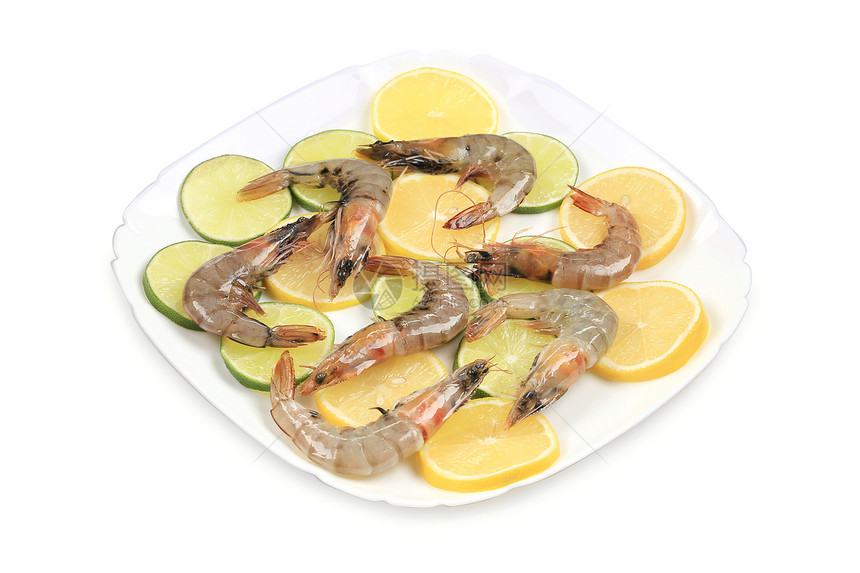 生虾盘加柠檬和石灰午餐贝类饮食绿色甲壳养殖营养美食白色黄色图片
