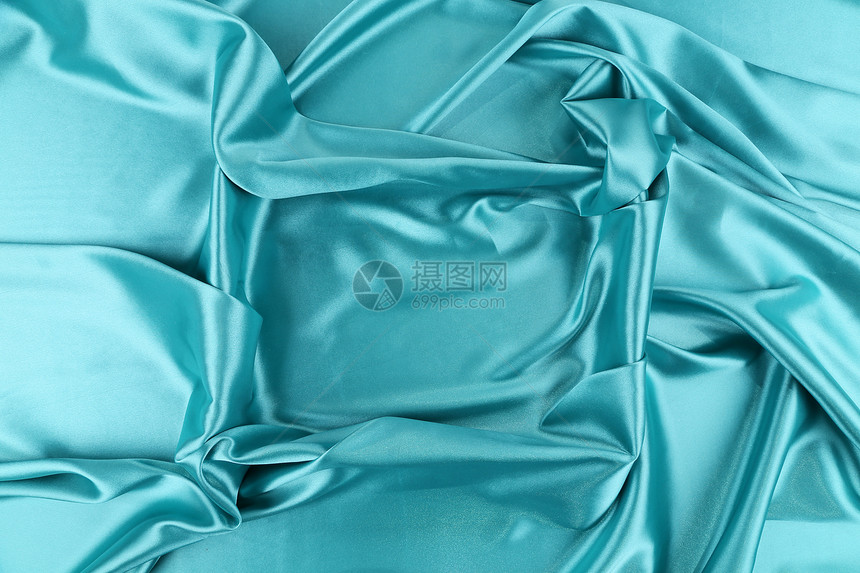 蓝丝柔软的折叠作为框架织物编织衣服材料丝绸床单窗帘图片
