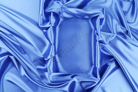 蓝丝柔软的折叠作为框架织物床单编织窗帘衣服丝绸材料背景图片