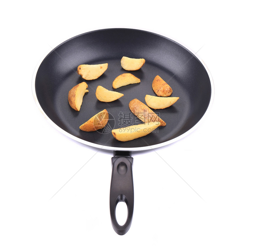 炸薯条在黑煎锅上金属白色油炸土豆平底锅食物黑锅黑色圆形图片
