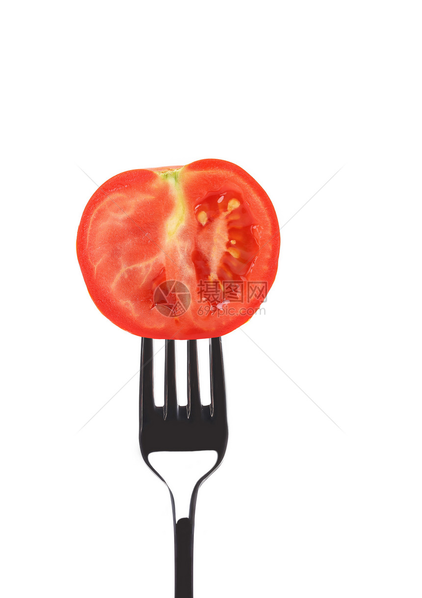 红熟番茄在叉子上图片