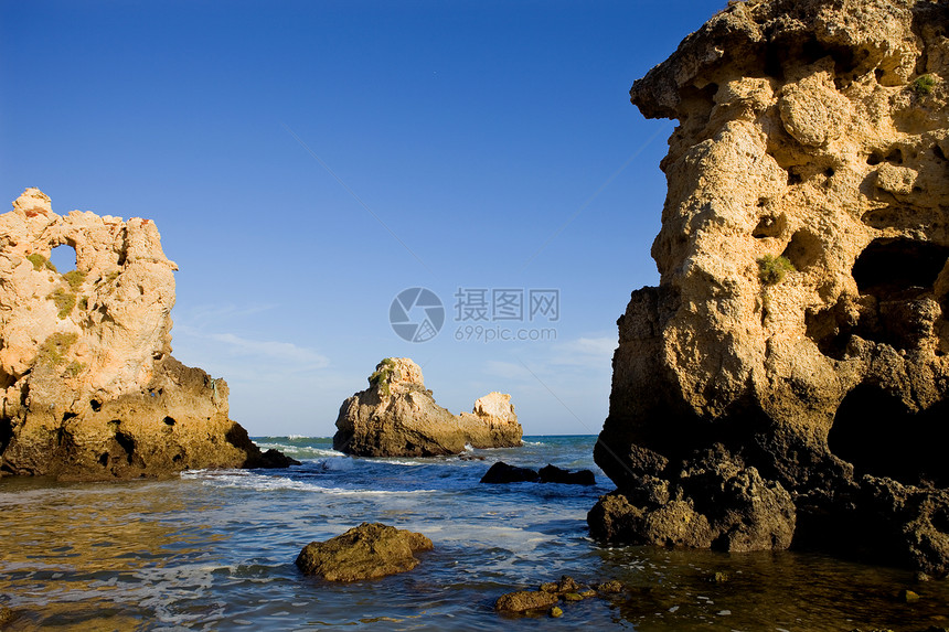 海滩沙滩砂岩旅行海岸风景国家环境娱乐海洋巨石蓝色图片