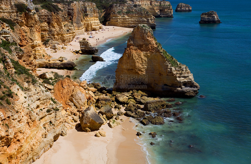 海滩沙滩反射风景地标蓝色海岸国家岩石娱乐橙子悬崖图片